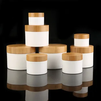 Geri dönüşümlü CBD boş kozmetik 1oz 3oz 5oz 8oz 100g 150g 200g 250g şeffaf beyaz ahşap bambu kapaklı plastik krem kavanozları amber buzlu kavanoz
